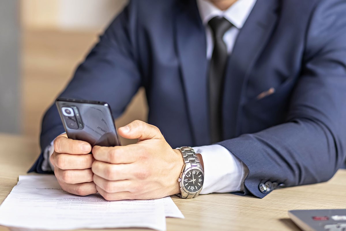 a-man-in-a-stylish-dark-blue-suit-is-sitting-in-th-2022-08-01-03-52-33-utc-copy.jpg