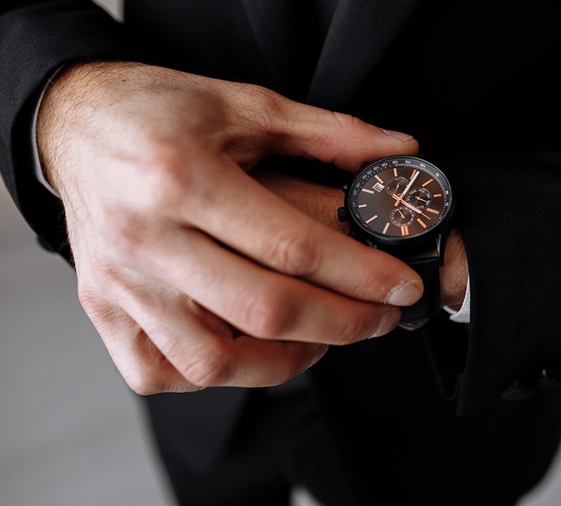 businessman-looks-at-the-watch-on-his-wrist-looks-2022-08-11-16-04-24-utc-copy.jpg